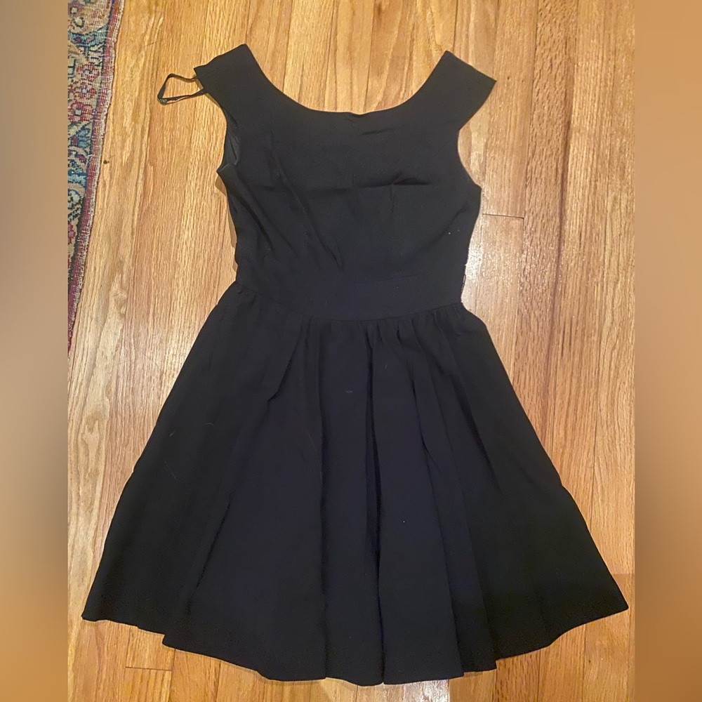 Black dress with boat neck and twirly bottom